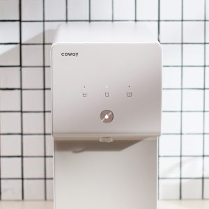 front-view-of-home-water-purifier-with-touch-panel-being-displayed-coway-cinnamon
